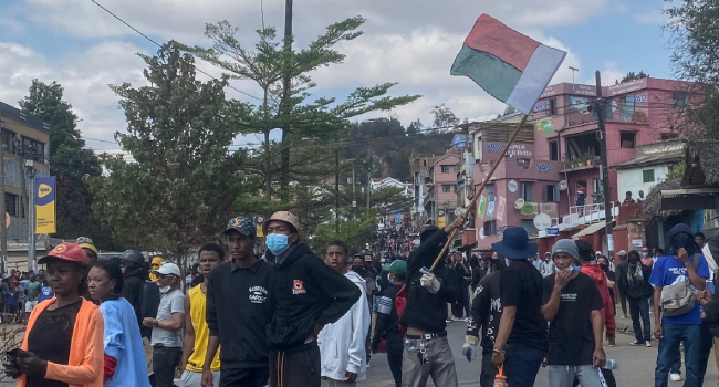 A Protester Waves A Madagascar Flag During A Demonstration
