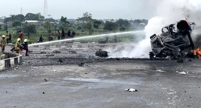 Fire Fighters Putting Out An Flames From A Petrol Laden Tanker Explosion At Obiri Ikwerre Flyover In Port Harcourt On Tuesday