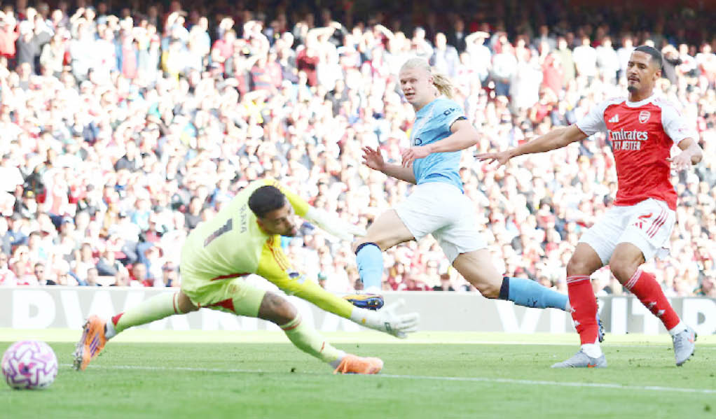 Manchester City Striker Erling Haaland Wheels Away After Opening The Scoring Against Arsenal Yesterday