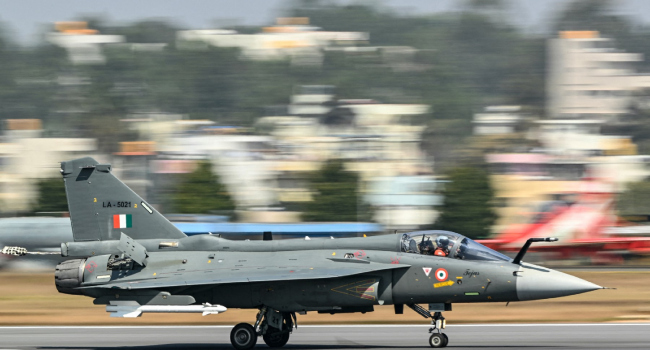 The Indian Air Force Iaf Hal Tejas Fighter Jet Prepares To Take Off During Aero India 2025 A Mili