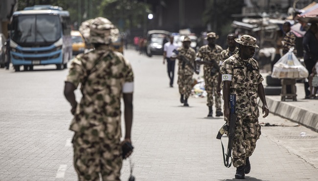 A Soldier From The Nigerian Armed Forces Takes Position And Secures The Streets In Lagos Island 2