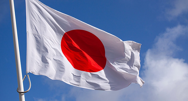 Japan Flag Waving In The Wind Against Blue Sky 2