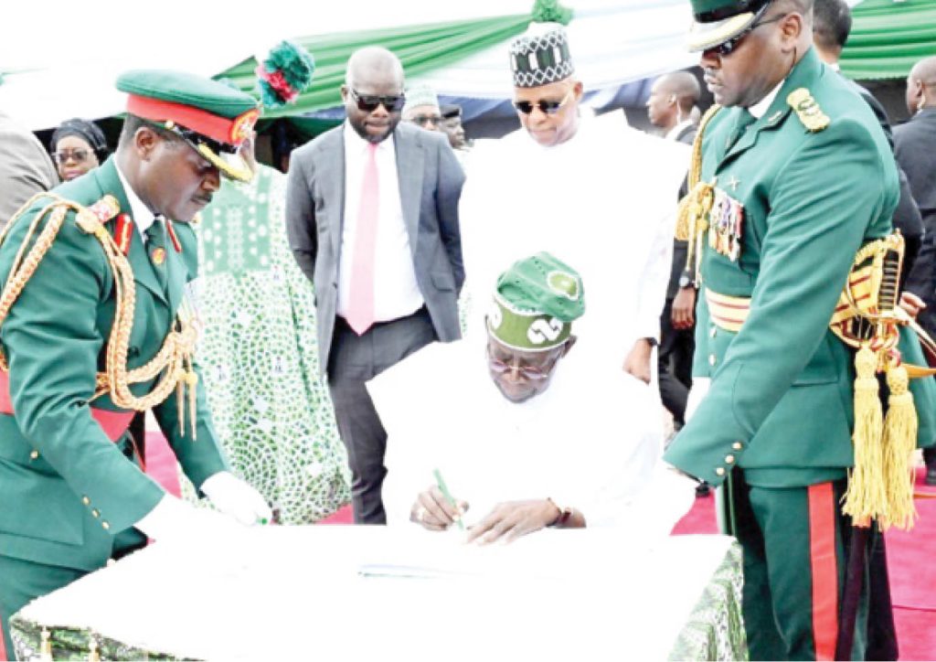 President Bola Ahmed Tinubu Signing The Last Year Independence Anniversary Register During The 64Th Celebration At The State House Abuja
