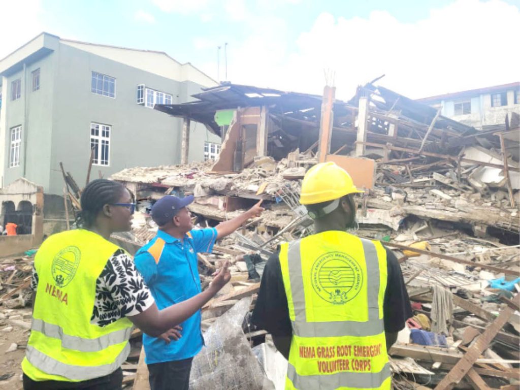 Rescue Team Of The National Emergency Management Agency Nema At The Scene Of The Collapsed Building In Lagos Yesterday