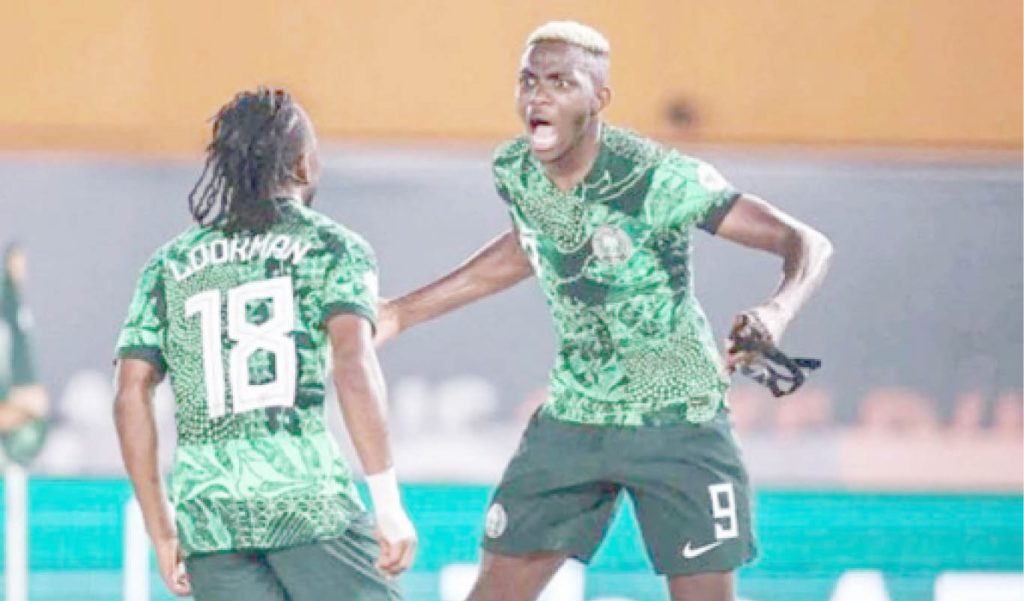 Super Eagles Forwards Ademola Lookman And Victor Osimhen Celebrating A Goal Together In A Recent Game. File Photo
