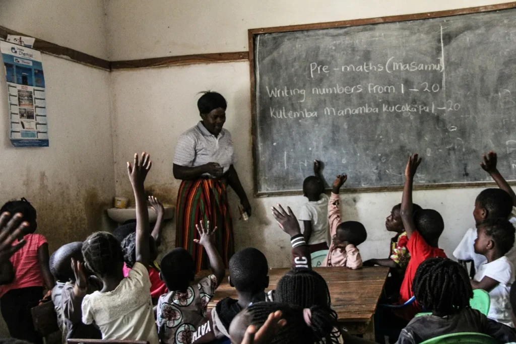 Teacher And Pupils In Classroom