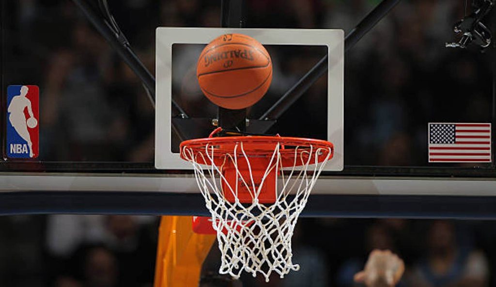 Denver A Detail Photo Of The Ball As It Falls Through The Rim As The Denver Nuggets Face The