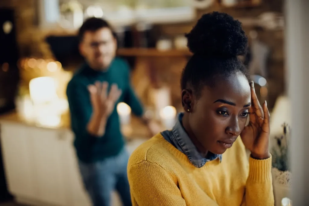 Distraught African American Woman Having Relationship Difficulties With Her Boyfriend Home