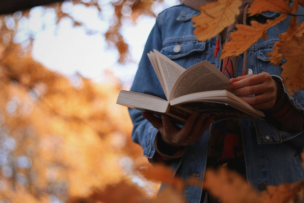 Hands Turning The Pages Of A Book