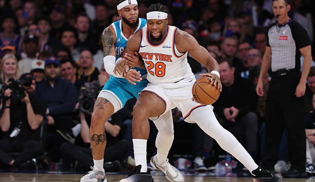 New York New York Guerschon Yabusele Of The New York Knicks Dribbles Against Miles Bridges Of