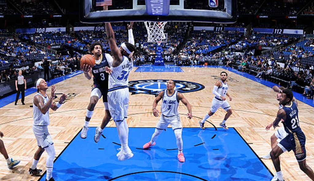 Orlando Fl Jordan Poole Of The New Orleans Pelicans Drives To The Basket As Wendell Carter Jr