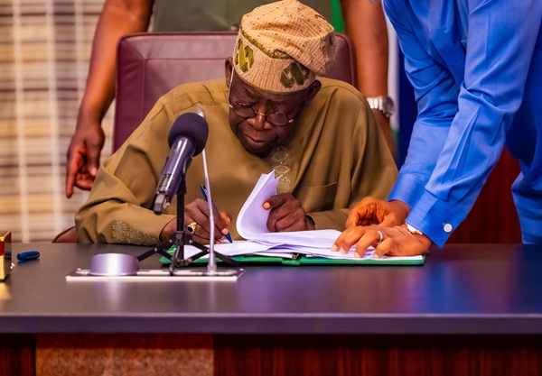 Tinubu Signs 1 Tinubu Signs 1