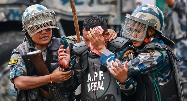 Nepals Armed Police Force Apf Personnel Carry An Injured Comrade As Demonstrators