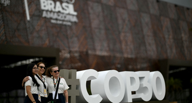 Volunteers Pose Outside The Hangar Convention And Exhibition Center Of The Cop30 The United Nations Volunteers Pose Outside The Hangar Convention And Exhibition Center Of The Cop30 The United Nations