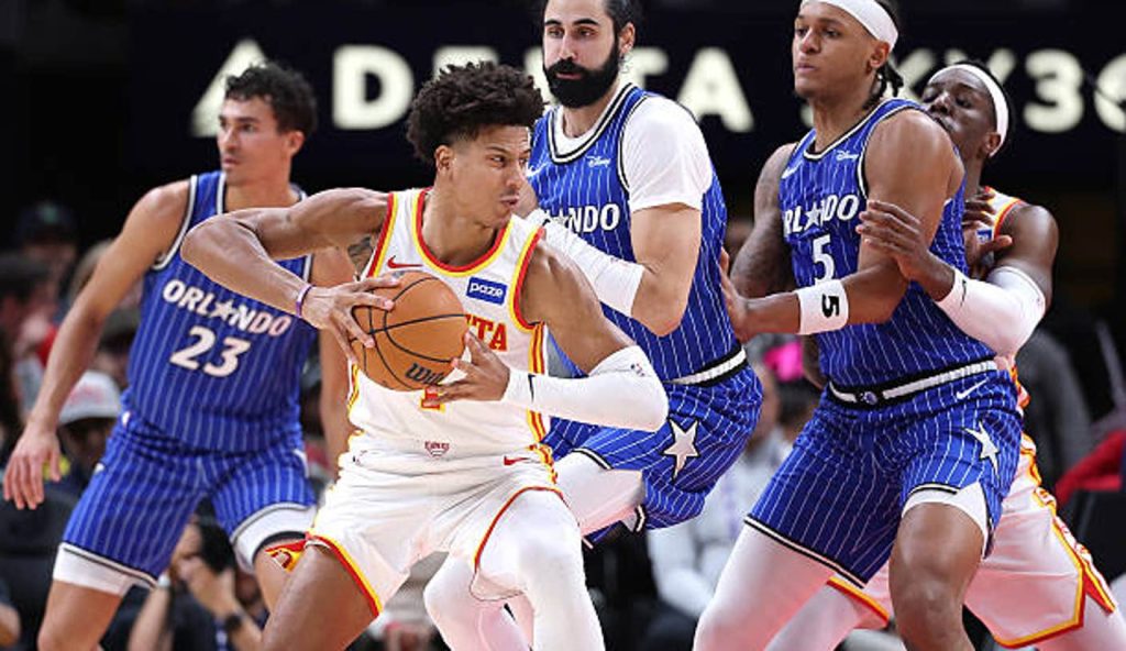 Atlanta Georgia Jalen Johnson Of The Atlanta Hawks Drives Against Goga Bitadze And Paolo