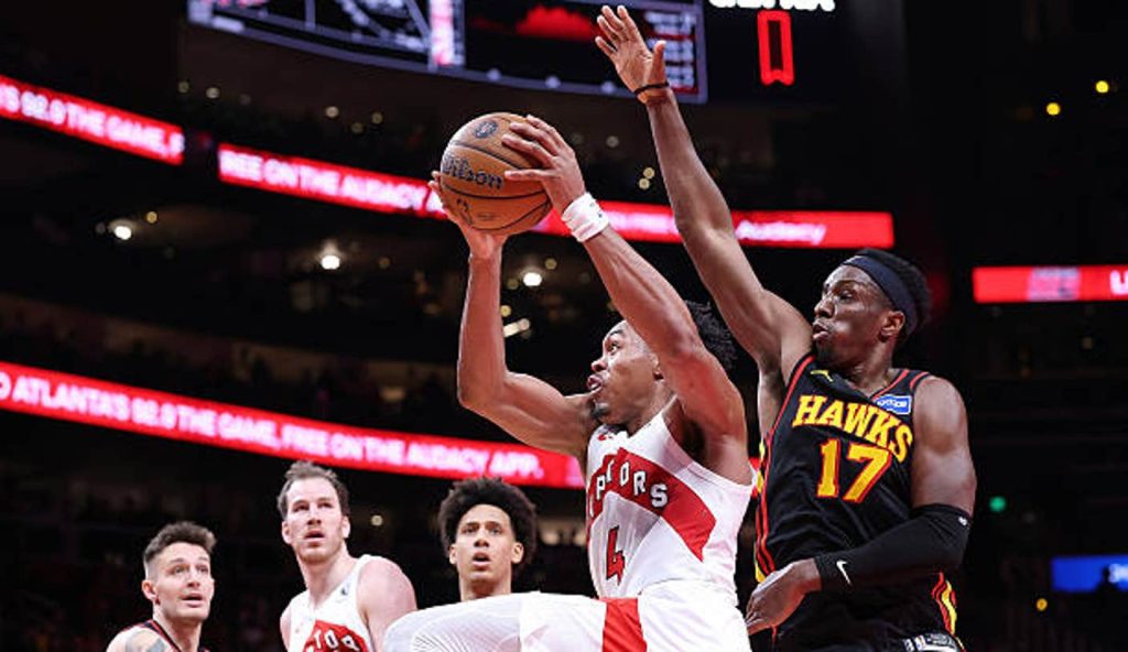 Atlanta Georgia Scottie Barnes Of The Toronto Raptors Drives Against Onyeka Okongwu Of The