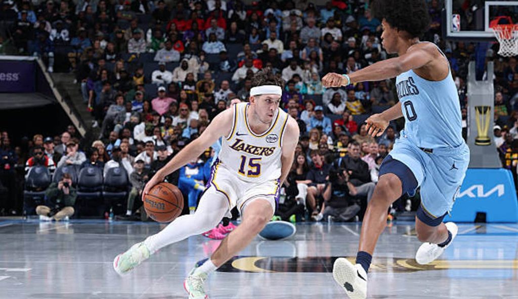 Memphis Tn Austin Reaves Of The Los Angeles Lakers Dribbles The Ball As Jaylen Wells Of The